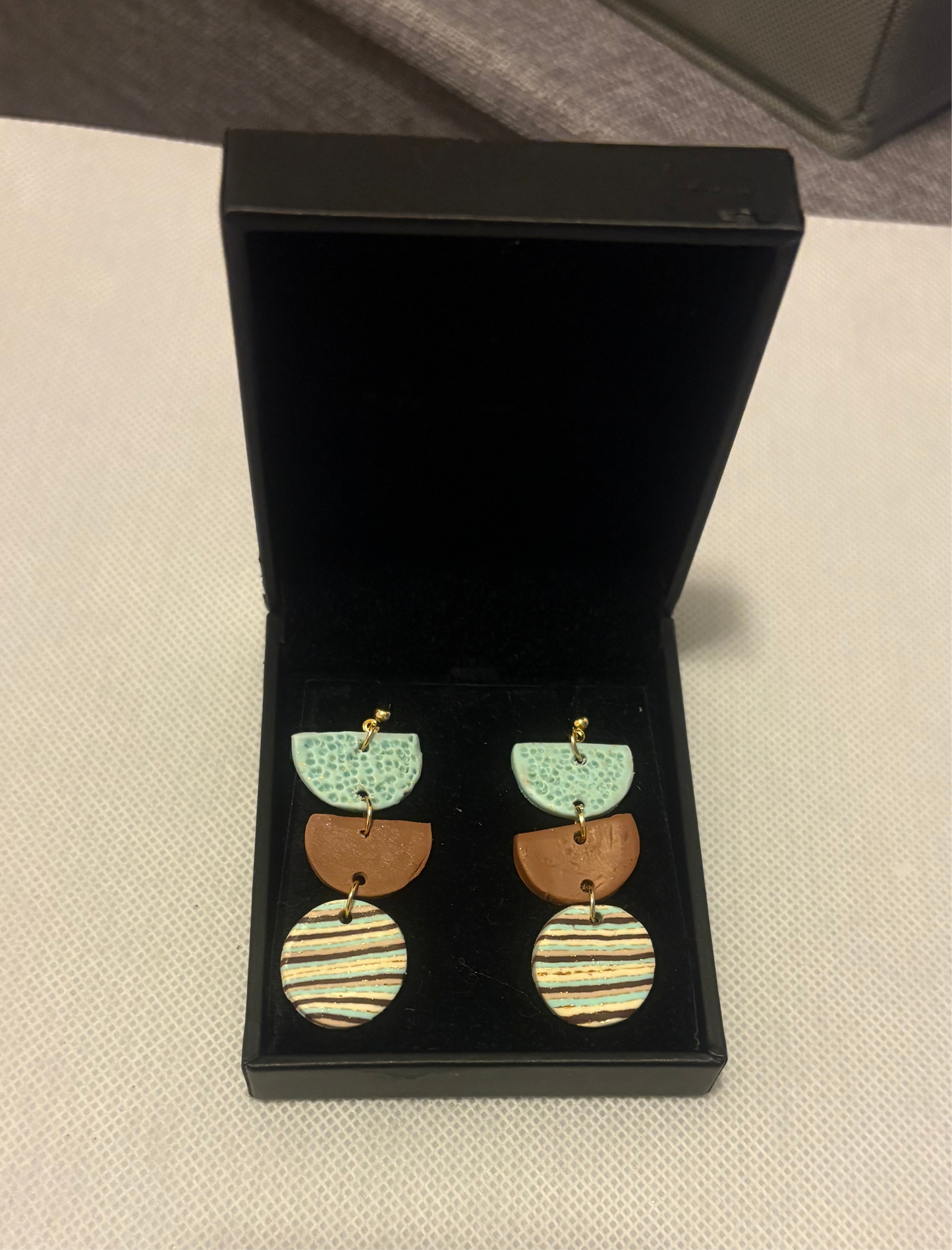 Turquoise and brown half circles dangles