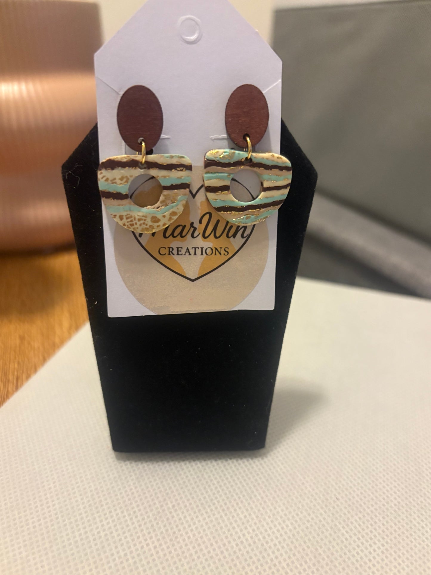 Wooden posts with turquoise and brown stripes