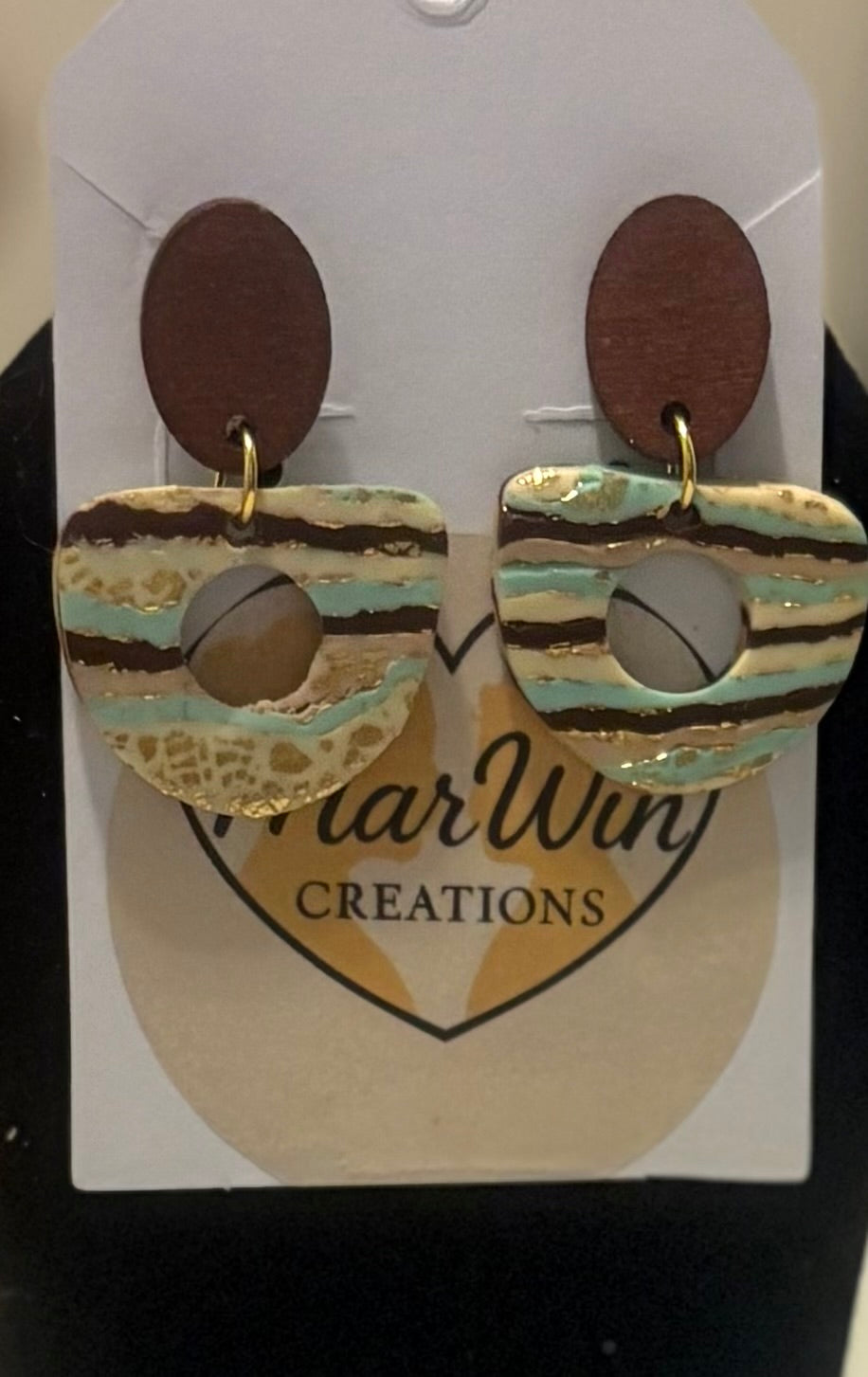 Wooden posts with turquoise and brown stripes