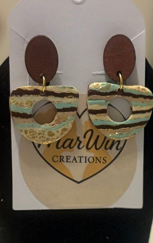 Wooden posts with turquoise and brown stripes